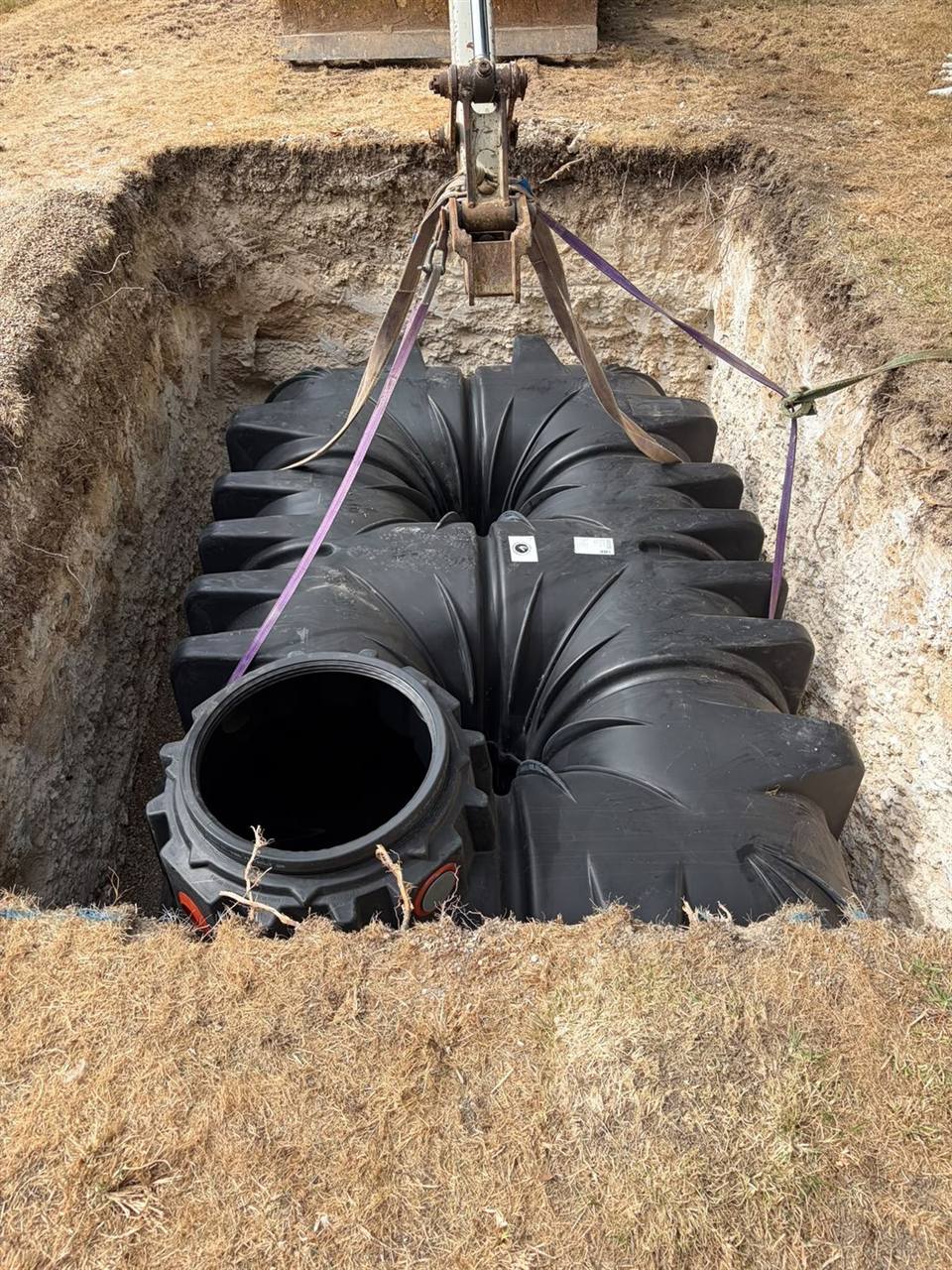 GRAF rainwater harvesting tank being lowered into an excavation
